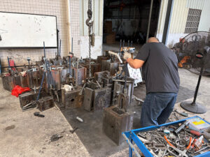 The microphone housing mold is being installed