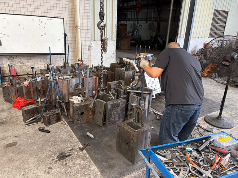 The microphone housing mold is being installed